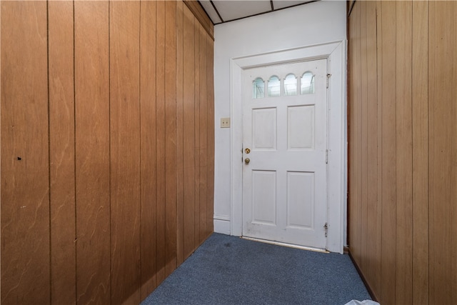 doorway to outside featuring carpet floors