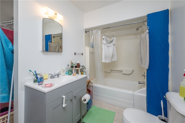 full bathroom with shower / tub combo, vanity, toilet, and tile patterned flooring