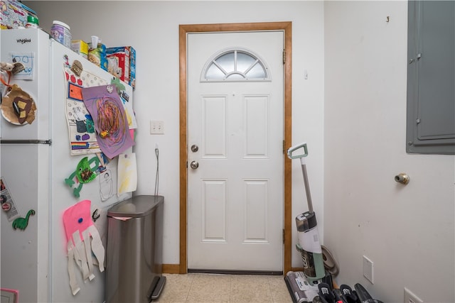 interior space featuring light tile patterned flooring and electric panel