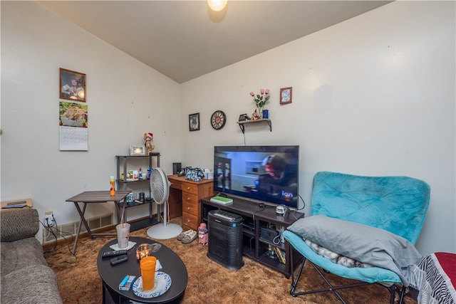 carpeted living room featuring vaulted ceiling