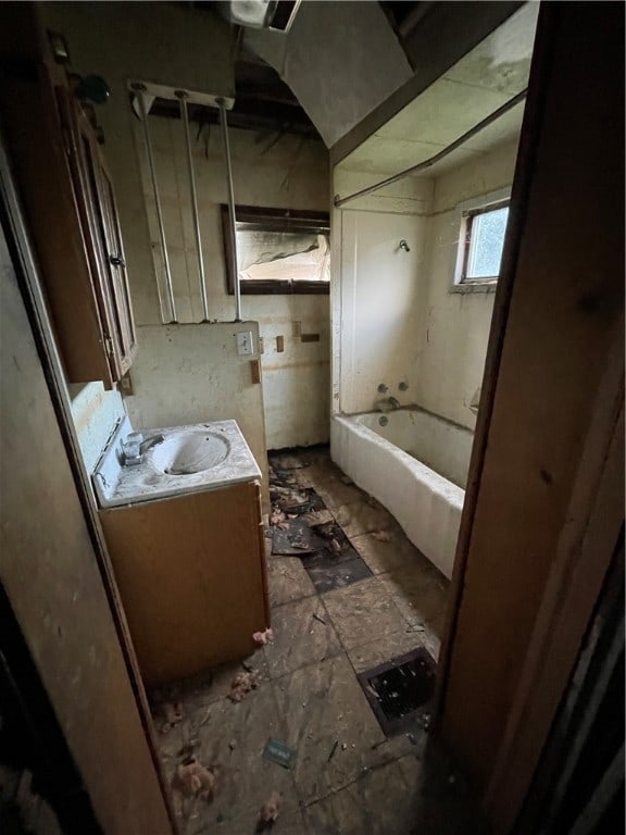 bathroom with vanity, shower / bath combination, and tile patterned flooring