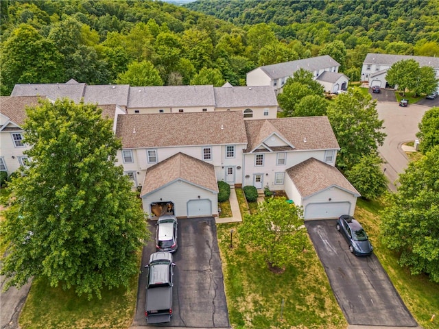 birds eye view of property featuring a residential view and a view of trees