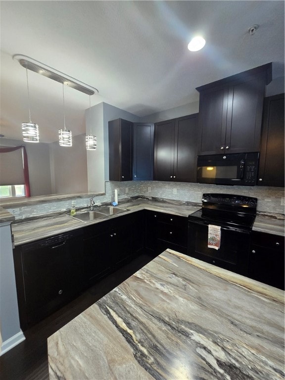 kitchen with dark hardwood / wood-style floors, sink, tasteful backsplash, black appliances, and decorative light fixtures