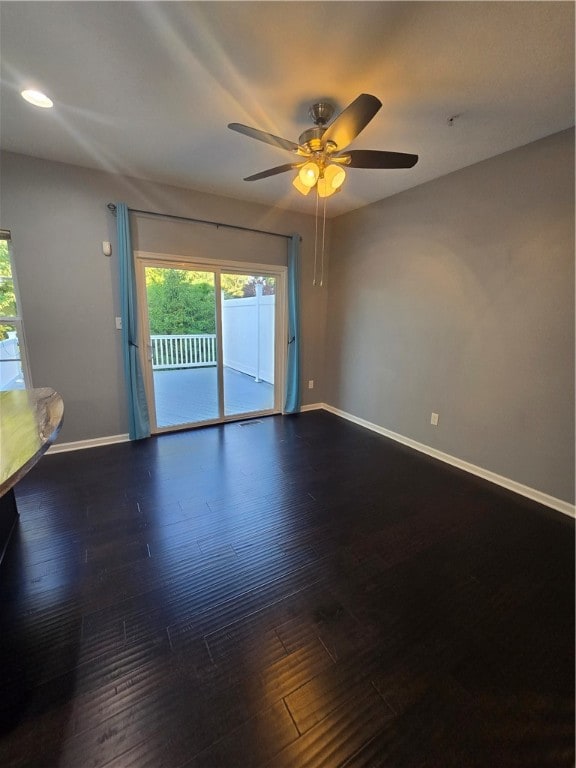 unfurnished room with ceiling fan and hardwood / wood-style flooring