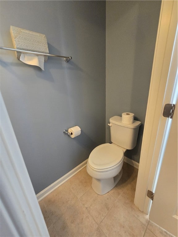 bathroom with tile patterned floors and toilet