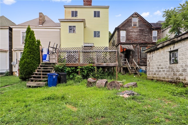 back of house with a lawn