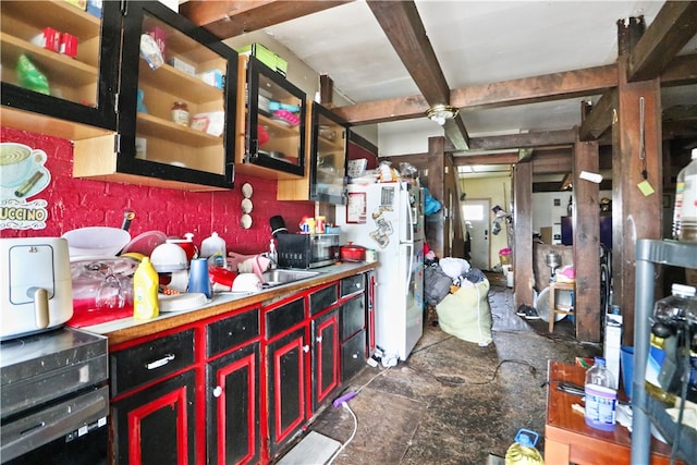 kitchen featuring white refrigerator and tile patterned flooring