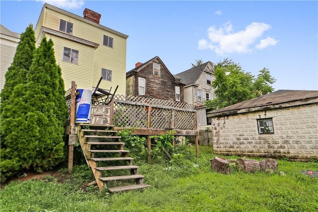 rear view of house with a wooden deck