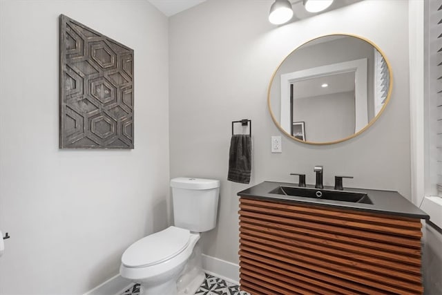 bathroom with tile patterned floors, vanity, and toilet