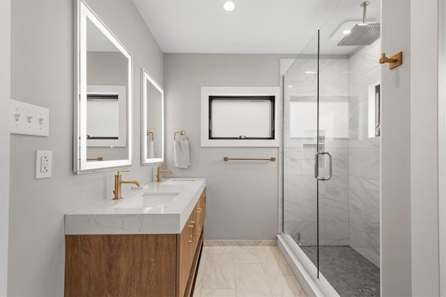 bathroom featuring vanity and a shower with door