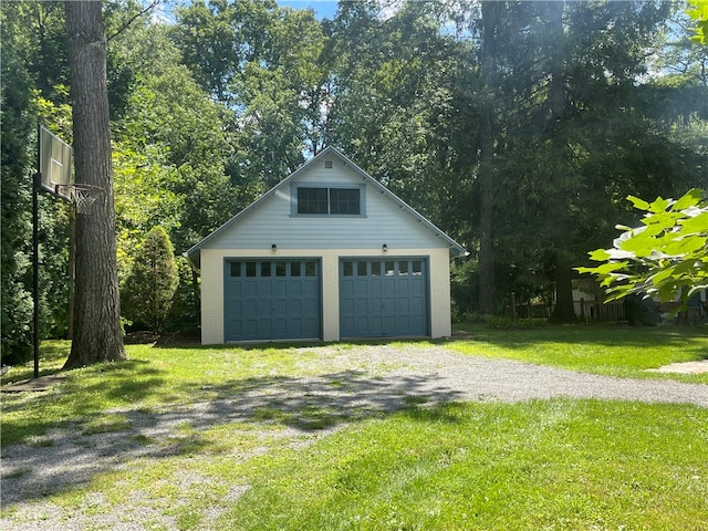 garage featuring a yard