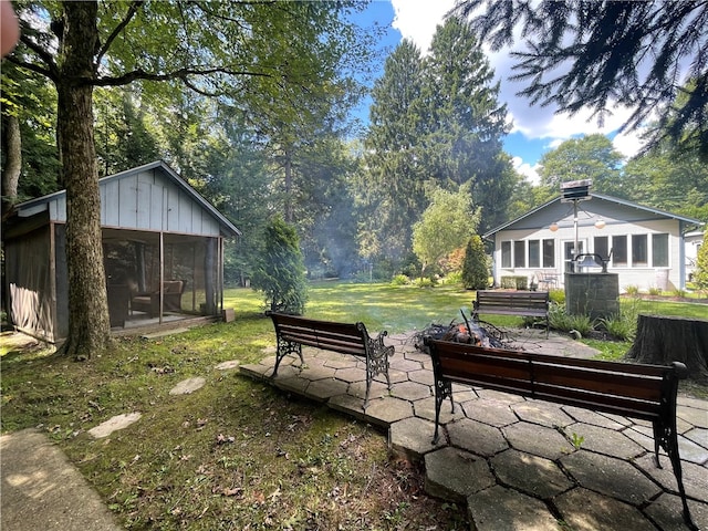 view of yard featuring a sunroom