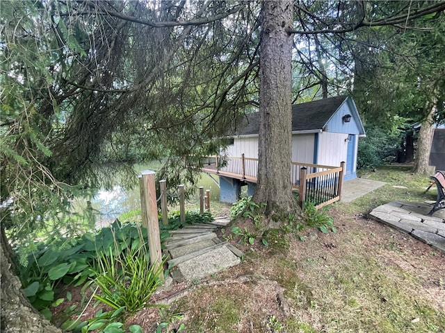 view of property exterior featuring a wooden deck