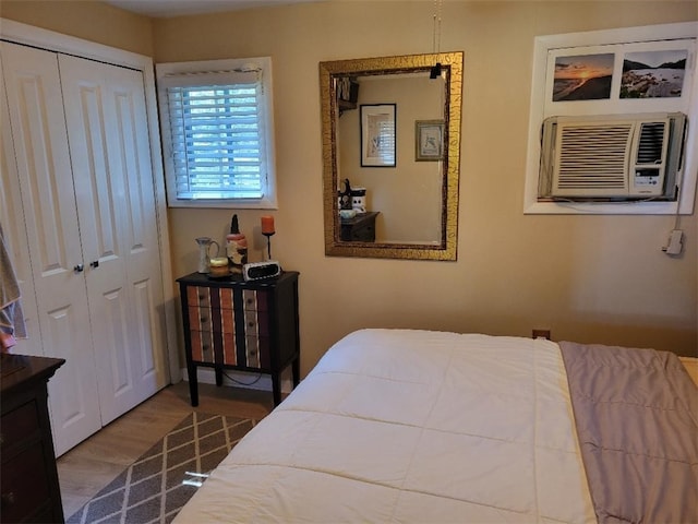 bedroom featuring cooling unit and hardwood / wood-style flooring