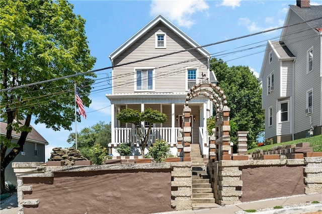 view of front property with cooling unit and covered porch