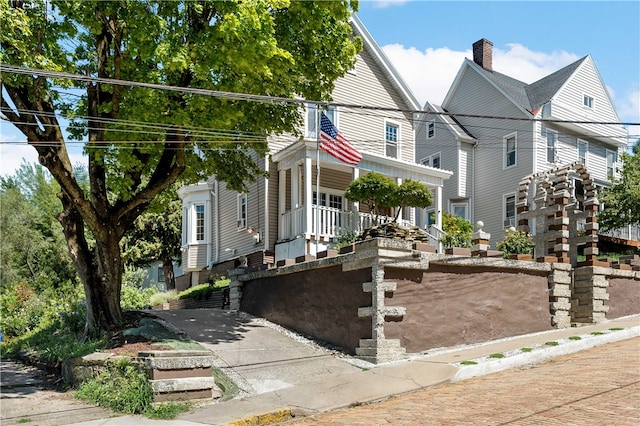 view of front facade featuring a garage and a porch