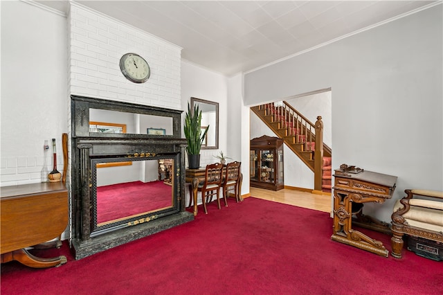 interior space with crown molding, carpet flooring, and brick wall