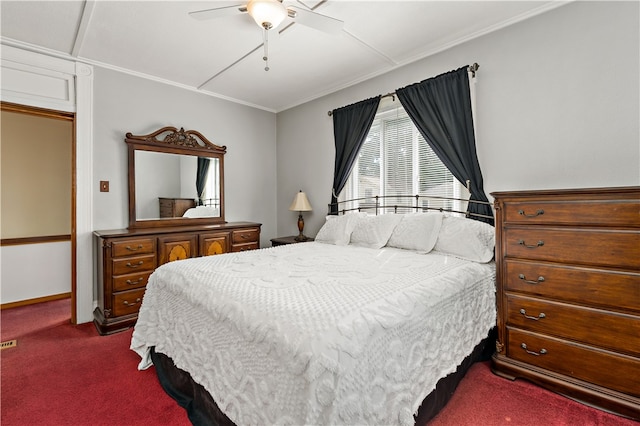 bedroom featuring ceiling fan, crown molding, and carpet flooring