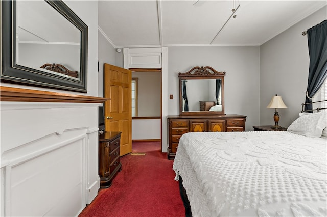 bedroom with ceiling fan, dark carpet, and ornamental molding