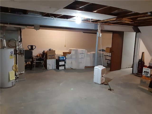 unfinished basement featuring gas water heater