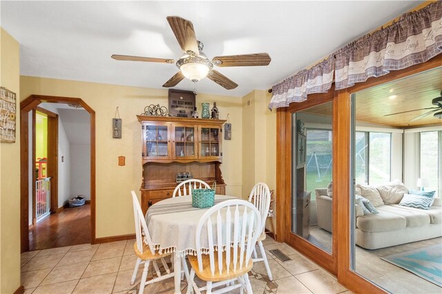 dining room with ceiling fan and light tile patterned flooring