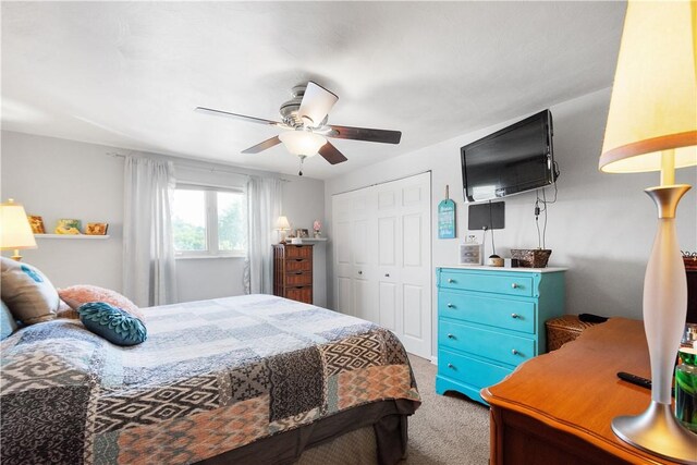 bedroom with carpet flooring, a closet, and ceiling fan