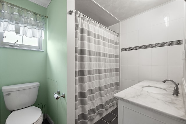 bathroom with curtained shower, tile patterned flooring, toilet, vanity, and tile walls