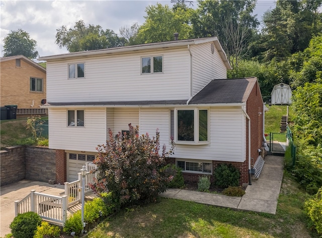 back of house with a garage