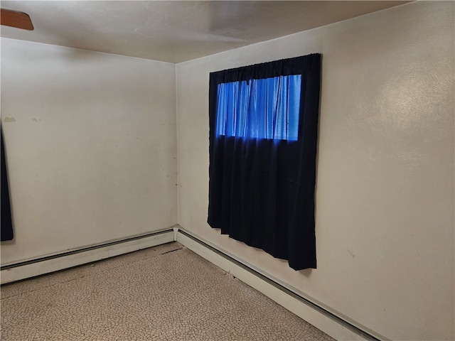 spare room with a baseboard heating unit