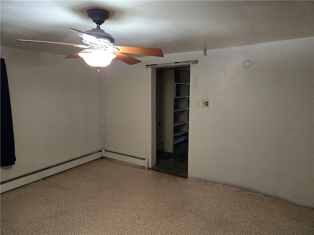 spare room with ceiling fan and carpet flooring