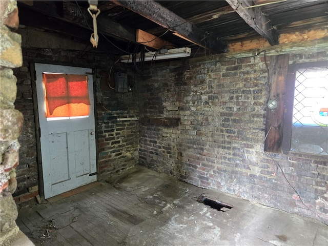 interior space with brick wall and a wealth of natural light