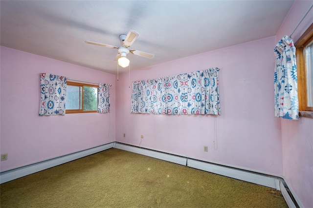 carpeted spare room with baseboard heating and ceiling fan