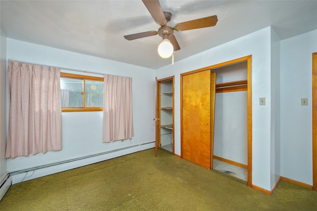 unfurnished bedroom featuring a baseboard heating unit, ceiling fan, a closet, and carpet floors