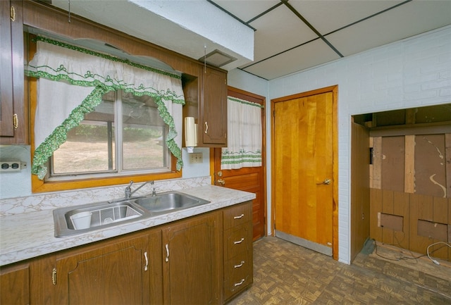 kitchen with dark parquet flooring and sink