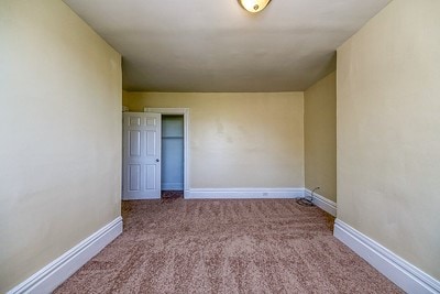 unfurnished bedroom featuring carpet floors