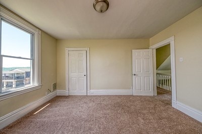 unfurnished bedroom featuring carpet