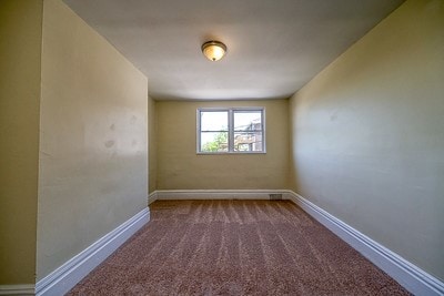 unfurnished room with carpet