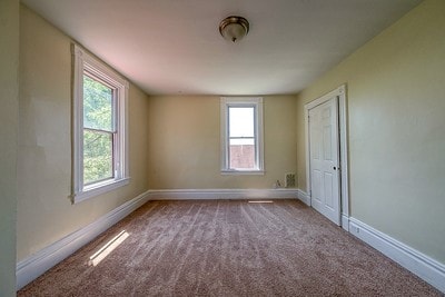 empty room featuring carpet flooring