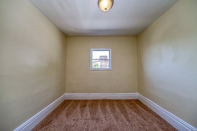 empty room featuring carpet floors