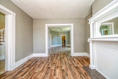 corridor featuring wood-type flooring