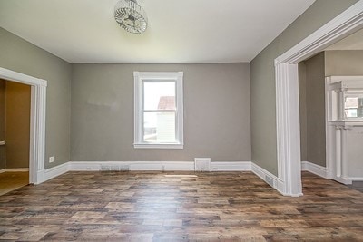 unfurnished room featuring hardwood / wood-style flooring