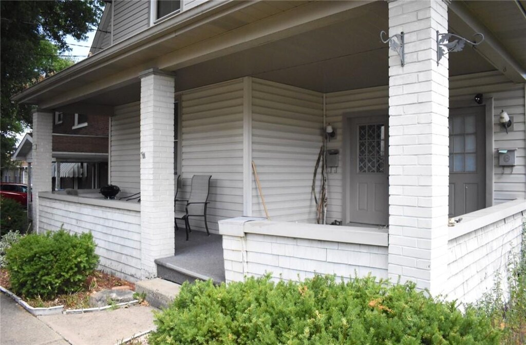 14 S 5th St, Youngwood, PA 15697 - view of property exterior with covered porch