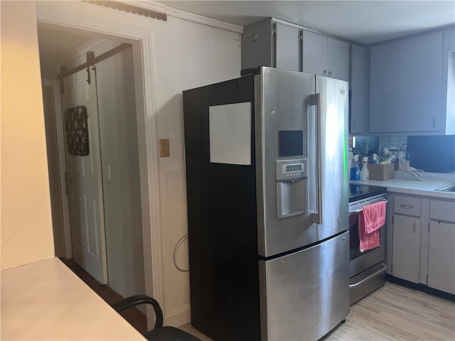 kitchen featuring tasteful backsplash, light wood-type flooring, stainless steel refrigerator with ice dispenser, and range with electric stovetop