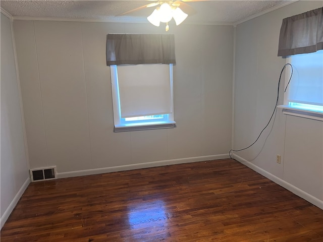 unfurnished room with ceiling fan, a textured ceiling, and dark hardwood / wood-style floors