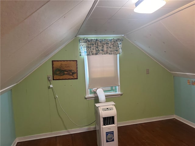 additional living space featuring lofted ceiling and hardwood / wood-style flooring