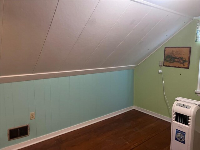 bonus room featuring lofted ceiling and hardwood / wood-style floors