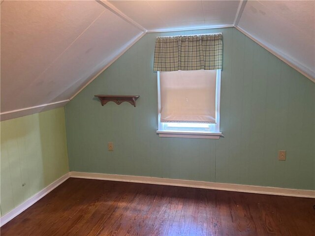 bonus room featuring hardwood / wood-style floors and vaulted ceiling