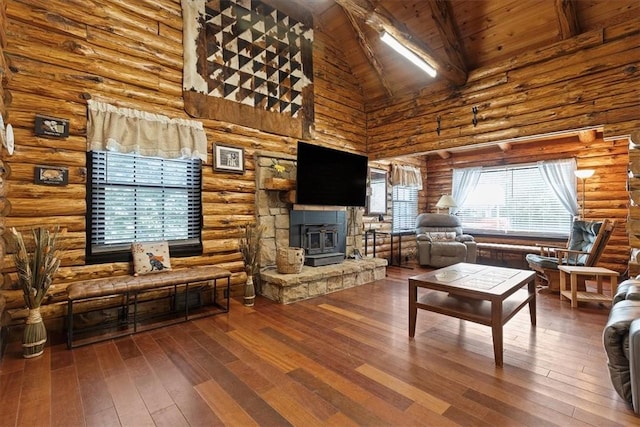 living room with high vaulted ceiling, a wood stove, hardwood / wood-style flooring, and wooden ceiling