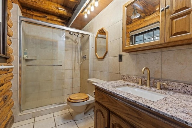 bathroom featuring an enclosed shower, vanity, beamed ceiling, tile patterned flooring, and toilet