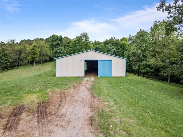 view of outbuilding with a yard